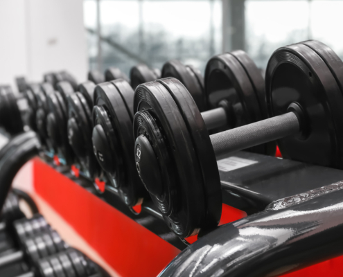 Rack With Different Dumbbells In Gym