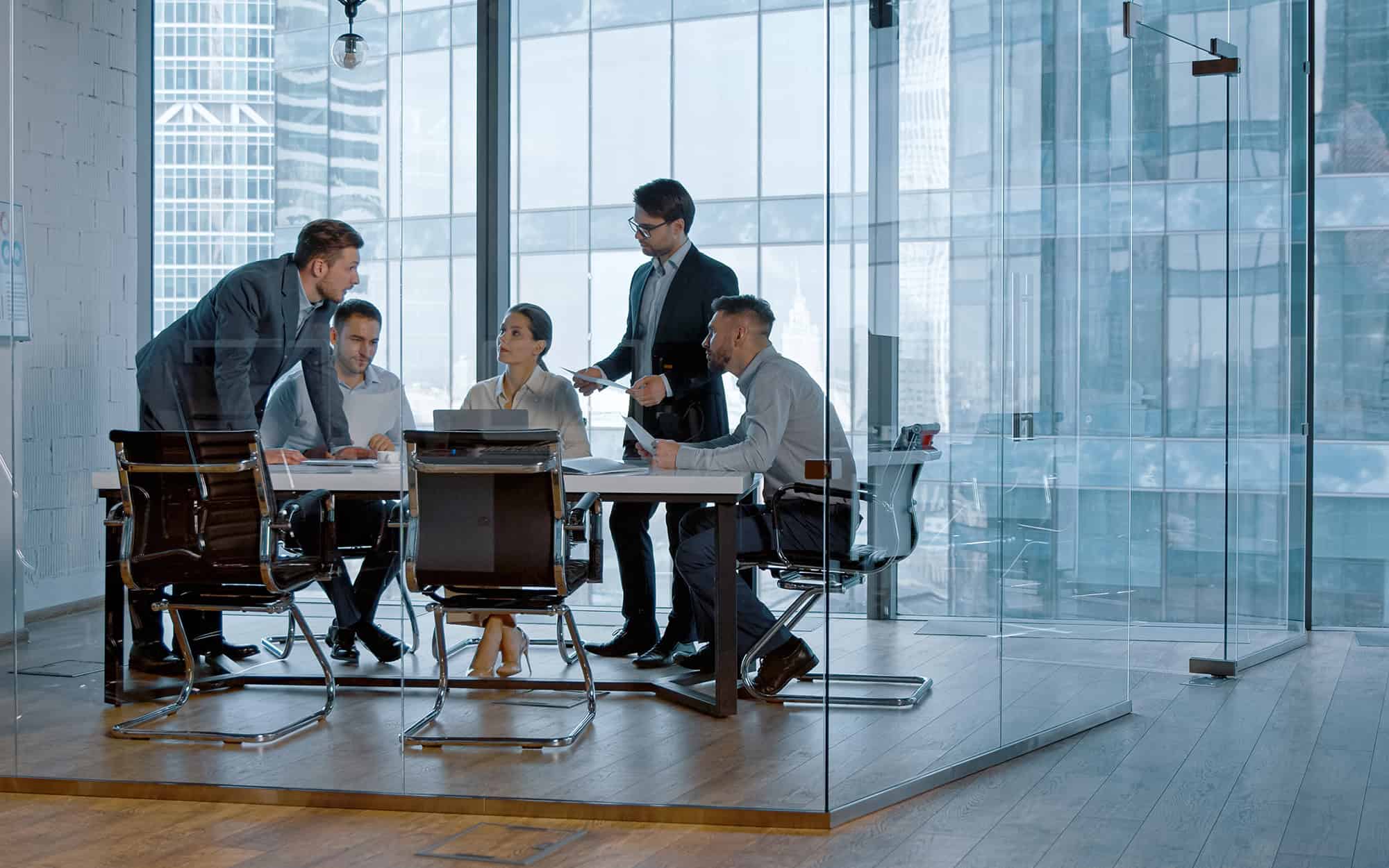 Side View Of Meeting In Glass Modern Office